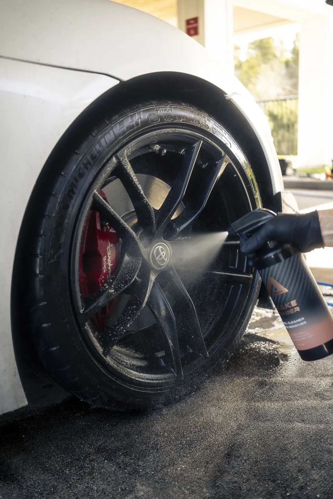 Wheel cleaner sprayed on a Toyota Supra during a mobile detail