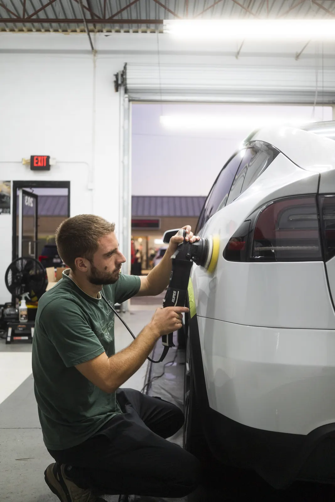 Paint correction on a Tesla Model X Plaid in the 355 Auto Spa bay